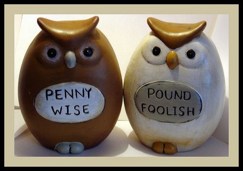 Two owl figurines labeled Penny Wise and Pound Foolish, a reminder not to cut the wrong corners in a divorce